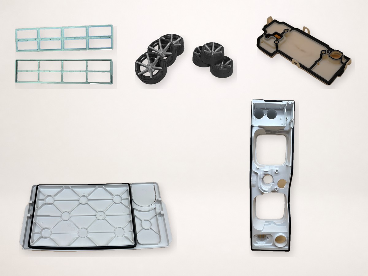 Two-shot molded frames, wheels and sealed housings